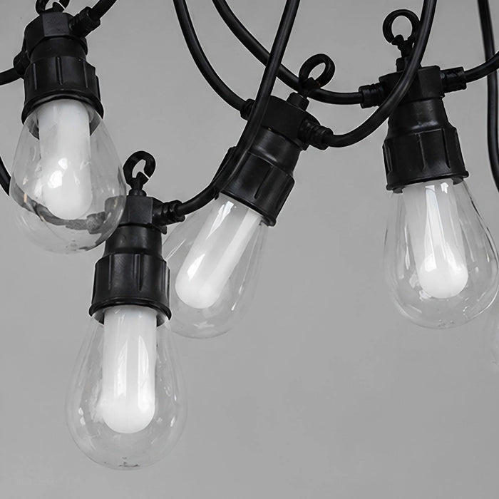 Close-up of unlit teardrop bulbs showing the frosted white LED tubes inside clear covers and black hook sockets